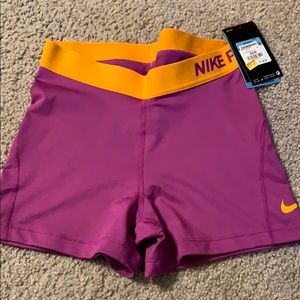 Purple/orange nike pros